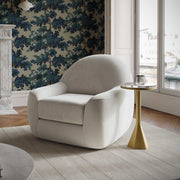 TOV Furniture Tiago swivel chair with modern design, padded seat, and backrest, featuring a sleek metal base and armrests.