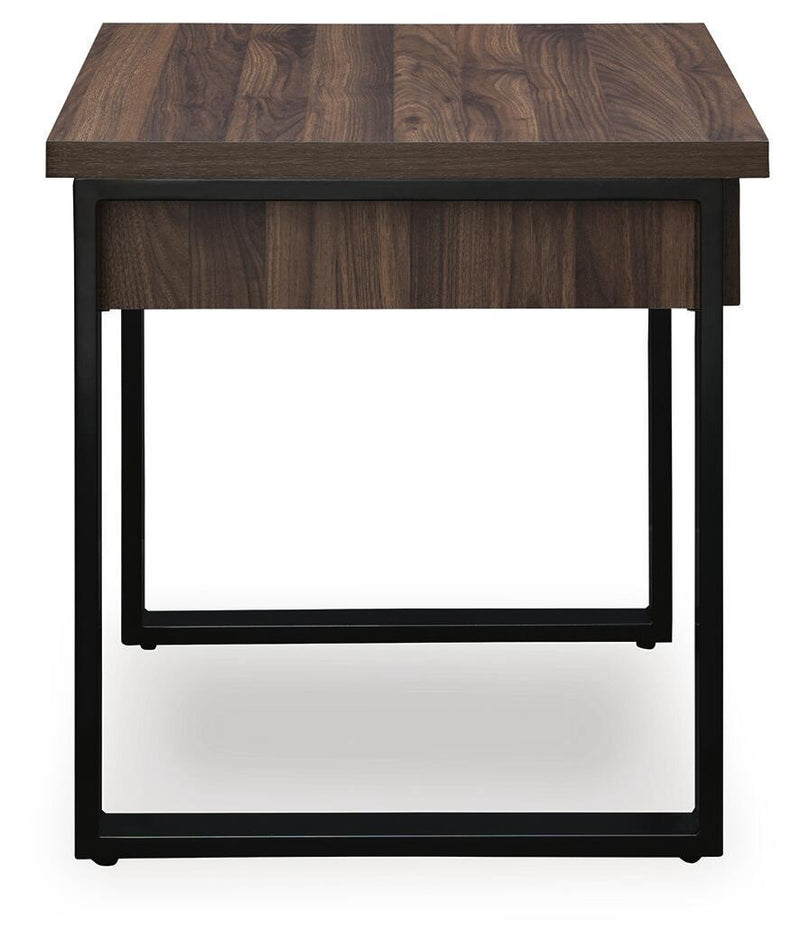 Signature Design by Ashley Wickman Falls rectangular cocktail table with a sleek wood finish and modern design.