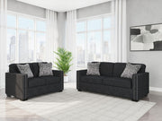 Benchcraft Jasmine Peaks living room set with stationary chair and ottoman, featuring plush upholstery and modern design.