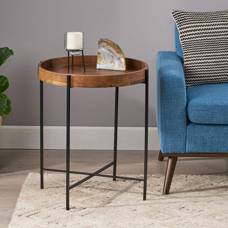 Modern industrial round end table with tray top and foldable iron legs, featuring a natural finish by Noble House.