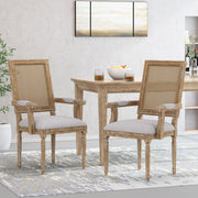 Elegant French country style arm dining chair with cane backrest by Noble House, showcasing a classic wooden frame and woven cane detail.