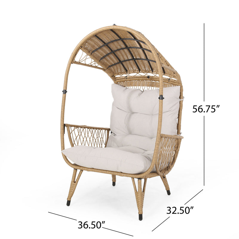 Noble House outdoor wicker standing basket chair with cushion, showcasing a cozy accent chair with woven wicker and plush cushion.