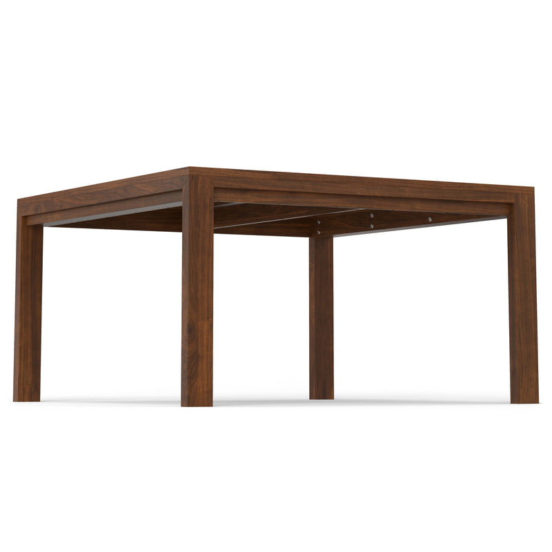 Wilson handcrafted dining table by Simpli-Home, showcasing a spacious wooden surface with sturdy legs for a stylish dining area.