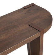 Classic Home Alenna round coffee table with a smooth wooden surface and modern design, perfect for living room decor.