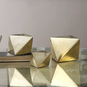Set of three champagne-colored Rhombus accents sculptures by Uttermost, modern decorative figurines for home decor.