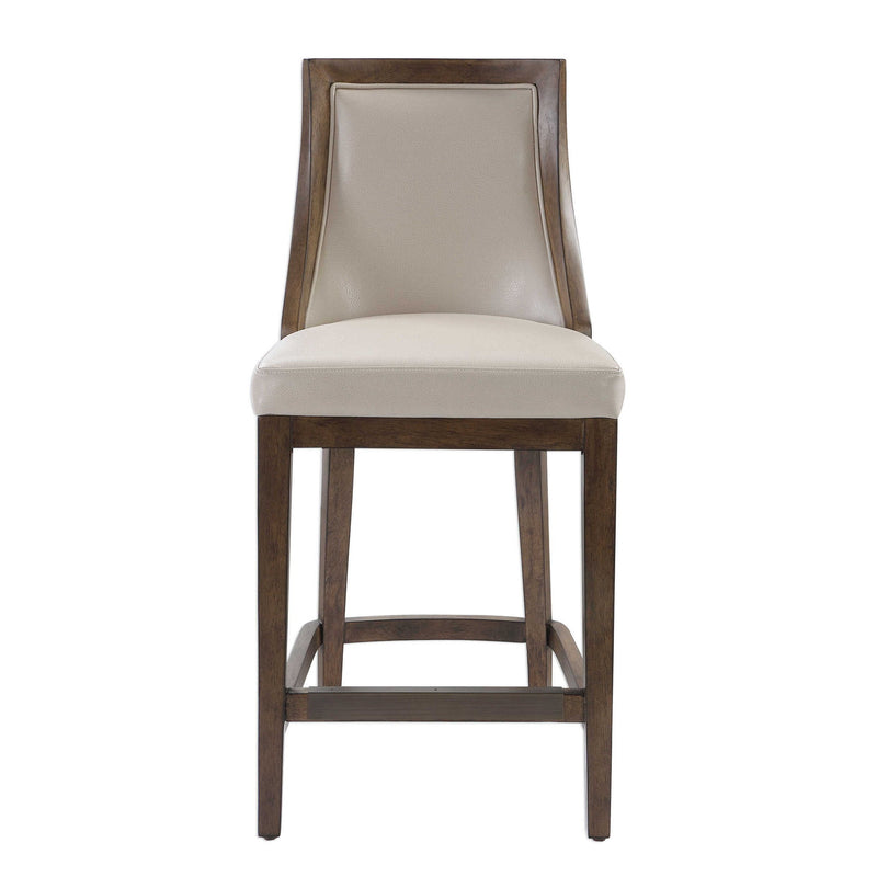 Uttermost beige Purcell counter stool with wooden legs and upholstered seat, ideal for kitchen or bar area.