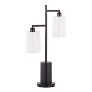 Lumi Source Cannes contemporary table lamp with sleek design, featuring a modern ceramic base and fabric shade on a wooden surface.