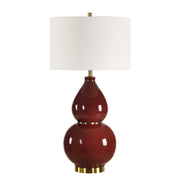 Uttermost gourd-shaped table lamp with a textured ceramic base and neutral fabric shade, ideal for modern home decor.