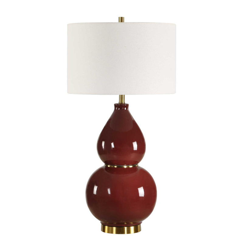 Uttermost gourd-shaped table lamp with a textured ceramic base and neutral fabric shade, ideal for modern home decor.