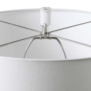 White Caelina textured table lamp by Uttermost, featuring a modern design with a detailed textured ceramic base.