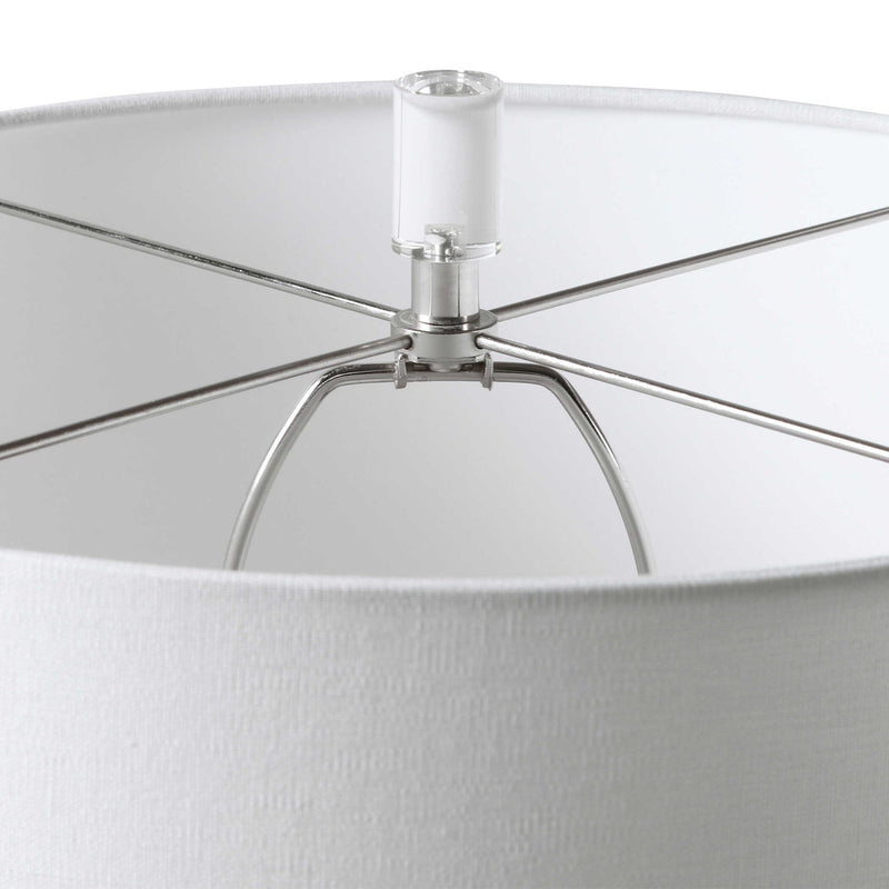 White Caelina textured table lamp by Uttermost, featuring a modern design with a detailed textured ceramic base.
