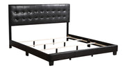 Glory Furniture Caldwell upholstered bed with a padded headboard and sleek frame, shown in a modern bedroom setting.