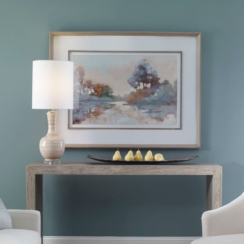 Watercolor framed print of a serene morning lake scene in blue by Uttermost, showcasing vibrant colors and elegant framing.