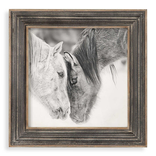 Framed print of black and white horses on dark brown background by Uttermost, showcasing detailed horse artwork in a stylish frame.