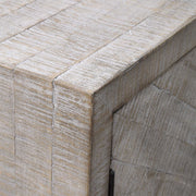 White washed Adalind accent cabinet by Uttermost featuring a rustic wood finish and vintage-inspired design.