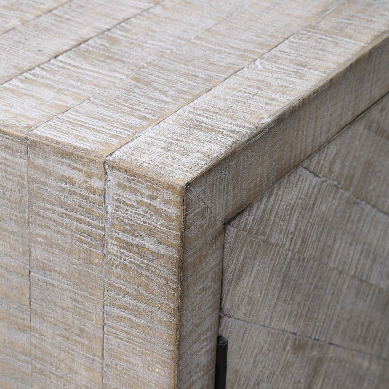 White washed Adalind accent cabinet by Uttermost featuring a rustic wood finish and vintage-inspired design.