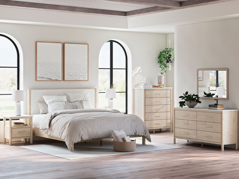 Signature Design by Ashley Cadmori six drawer dresser with sleek wood finish and modern hardware, featuring six spacious drawers.
