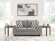 Benchcraft® stationary loveseat from Loreo with plush fabric and cushioned seats, perfect for cozy living room seating.