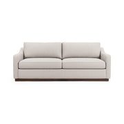 Classic Home Aspen stationary sofa with plush beige fabric, featuring cushioned arms and back for comfortable seating.