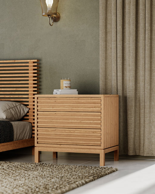 Modus Tanner ash wood nightstand with three drawers in flaxen finish, featuring a sleek, modern design and natural wood grain details.