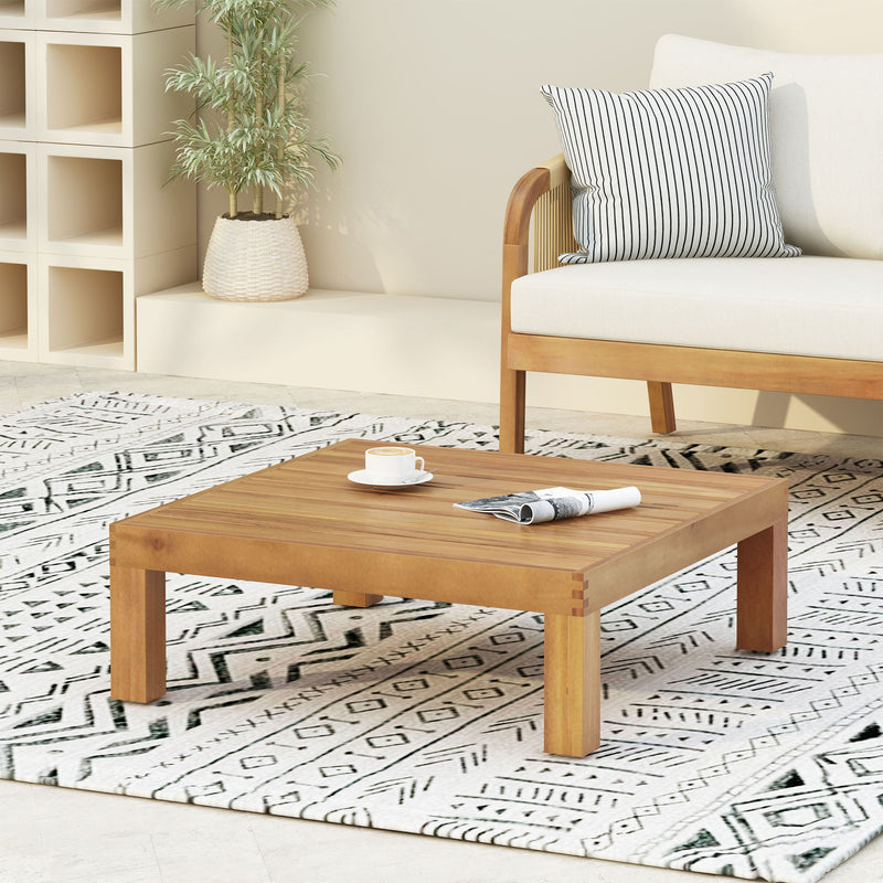 Square outdoor coffee table by Noble House with teak frame and slat top, ideal for patio or garden seating areas.