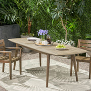 Noble House Placidity outdoor expandable dining table with slatted tabletop and tapered legs, suitable for patio or garden dining.