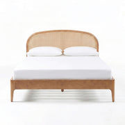 TOV Furniture Mico Rattan Panel Bed with natural wood finish and woven rattan headboard in a modern bedroom setting.