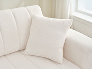 Urban Retreats Jessica lamb wool sectional sofa with chaise, showcasing a versatile stationary sectional with plush upholstery and modern design.