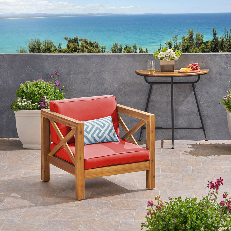 Noble House Brava mid-century modern arm chair with water-resistant cushions, plush seating and stylish wooden legs.