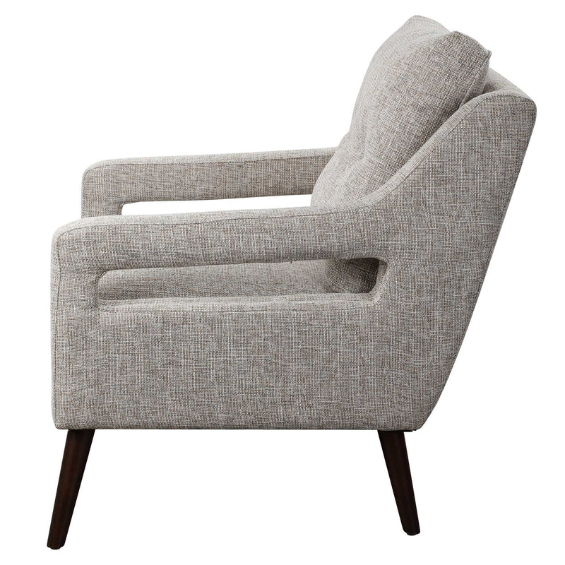 Uttermost O'Brien armchair with plush upholstery and wooden legs, showcasing a stylish and comfortable seating design.