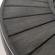 Gray propane outdoor fire pit table by LSI Patio Furniture with a modern, circular design and built-in flame feature.