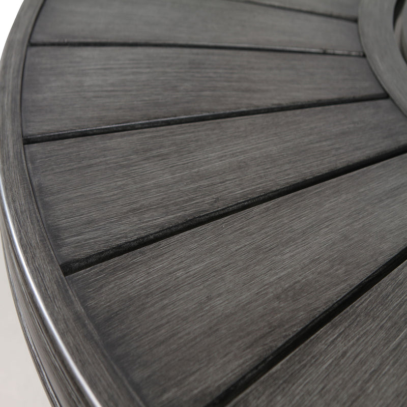Gray propane outdoor fire pit table by LSI Patio Furniture with a modern, circular design and built-in flame feature.