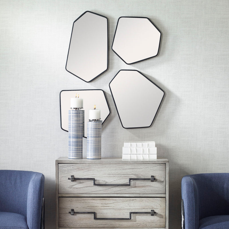 Set of four black wall mirrors from Uttermost's Linneah collection, featuring sleek rectangular frames for modern decor.