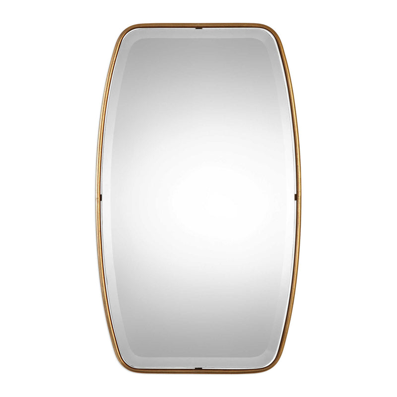 Uttermost Canillo wall mirror with a sleek, modern frame hanging on a wall, reflecting indoor decor.
