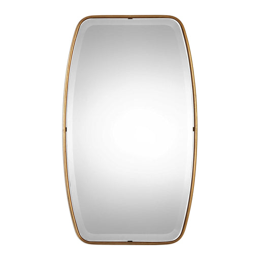 Uttermost Canillo wall mirror with a sleek, modern frame hanging on a wall, reflecting indoor decor.