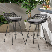 Noble House outdoor rattan bar stool with metal legs, featuring a woven rattan seat and sleek metal frame for patio seating.