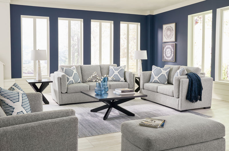 Benchcraft Evansley living room set with stationary chair and matching ottoman, featuring plush fabric and modern design.