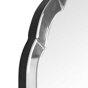Uttermost Brayden frameless arched wall mirror with pearl silver finish, showcasing its elegant curved design and sleek border.