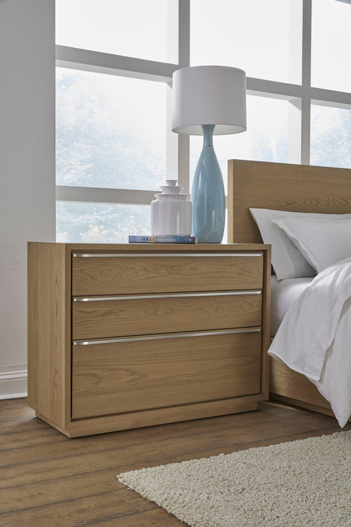Modus Coastal Modern three-drawer USB-charging nightstand in bisque with sleek design and integrated charging ports.
