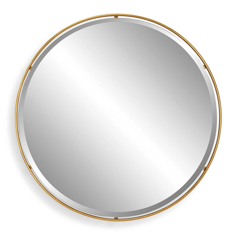 Round gold accent mirror by Uttermost with a sleek, modern frame, perfect for stylish interior decor.