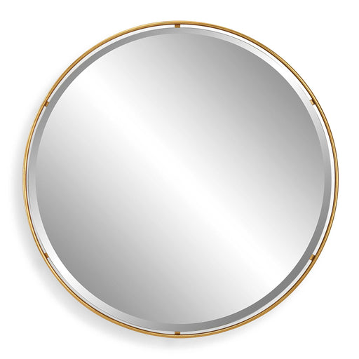 Round gold accent mirror by Uttermost with a sleek, modern frame, perfect for stylish interior decor.