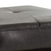 Upholstered Glory Furniture casual ottoman with plush fabric, perfect for stylish living spaces, shown in a modern interior setting.