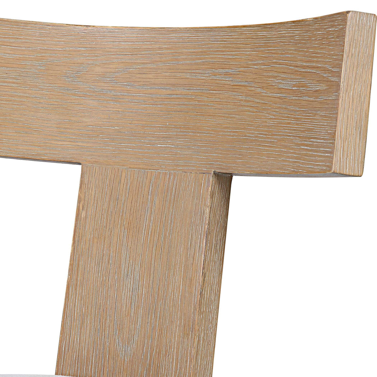 Uttermost Idris armless side chair with upholstered seat and wooden legs, showcasing modern design and neutral fabric.