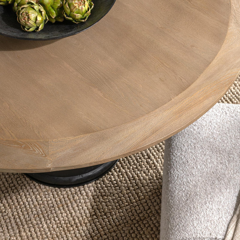 Lunen 55-inch round dining table by Classic Home in soft reef noir finish, showcasing its smooth tabletop and modern design.