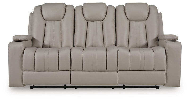 Signature Design by Ashley Elevate Edges reclining sofa with drop-down table in coin color, showcasing plush upholstery and armrests.