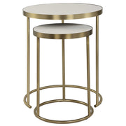 Pair of Uttermost Aragon nesting accent tables with metal frames and wooden tops, shown stacked together in a modern interior.