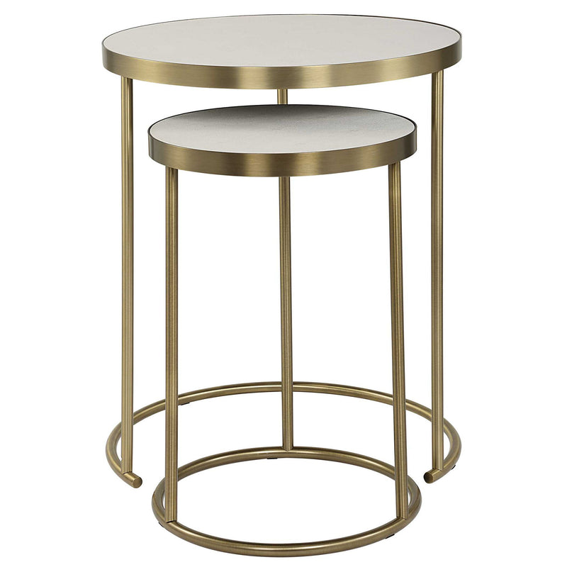 Pair of Uttermost Aragon nesting accent tables with metal frames and wooden tops, shown stacked together in a modern interior.