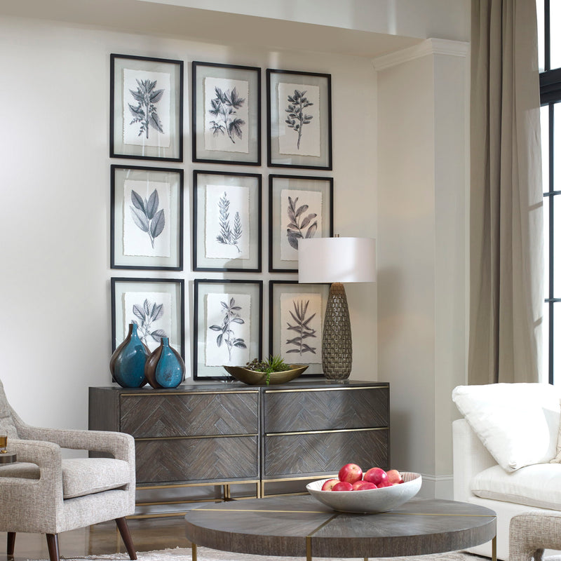 Set of nine Uttermost farmhouse floral framed prints with black frames, featuring vintage botanical illustrations on a neutral background.