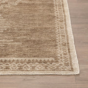 Hand-knotted Cairo area rug by Classic Home featuring intricate geometric patterns and rich, warm tones.