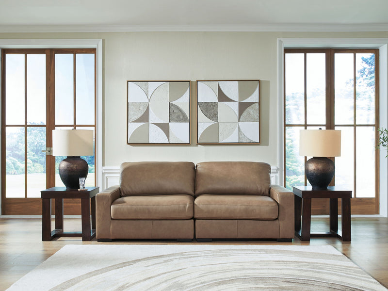 Benchcraft Veronella stationary sectional sofa with plush cushions and fabric upholstery in a modern living room setting.